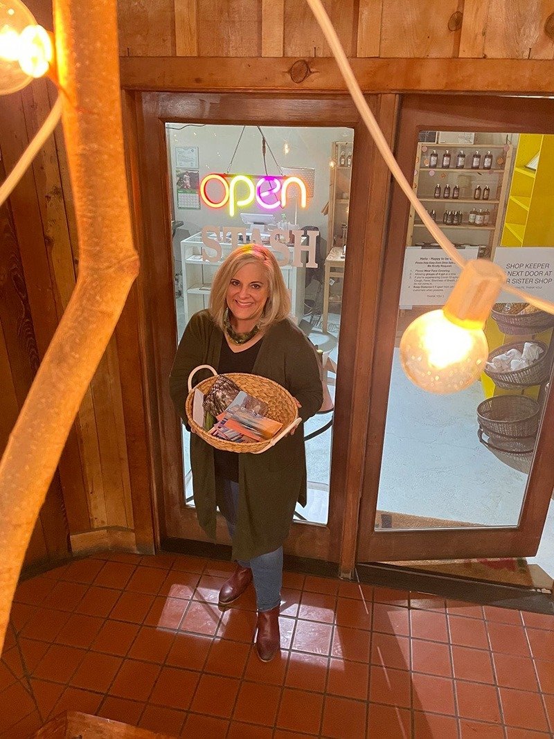 Jill Thayer with Sojourns postcards.